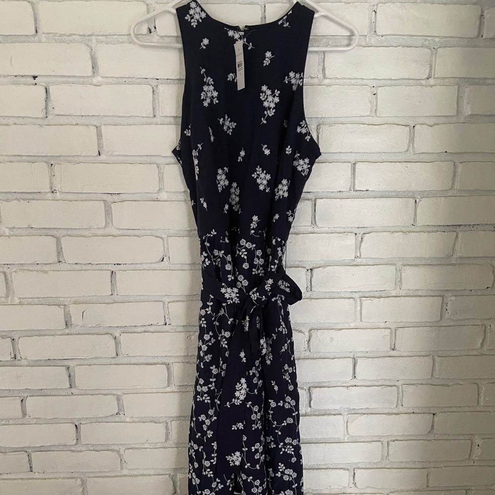 Navy Ann Taylor flowy maxi dress with white floral pattern.
